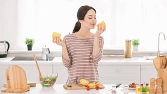 lady smelling bell pepper
